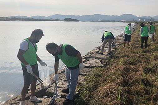 Photo: Participating in community cleanup activities