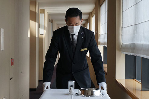 Photo: Staff carrying room service